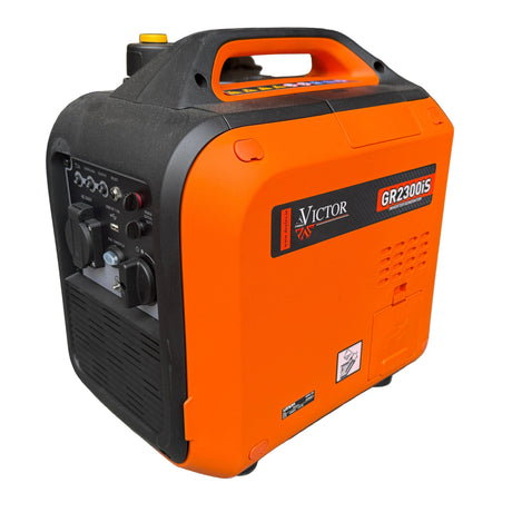 Victor GR2200iS portable generator and welder in orange and black, photographed on a concrete floor in an indoor workshop setting.